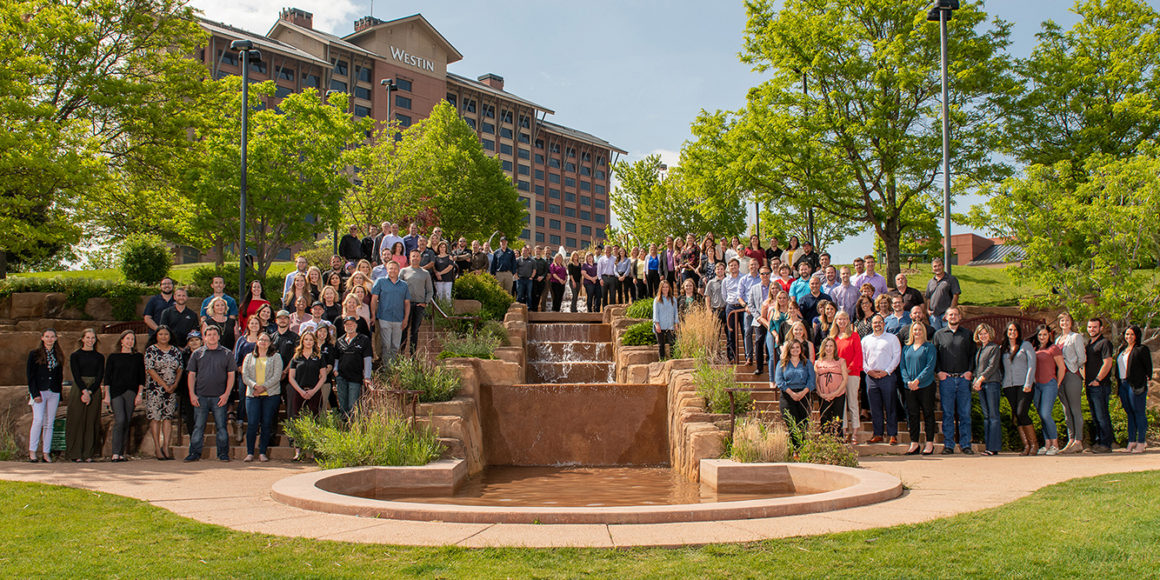 mcwhinney company employees gathered around a fountain