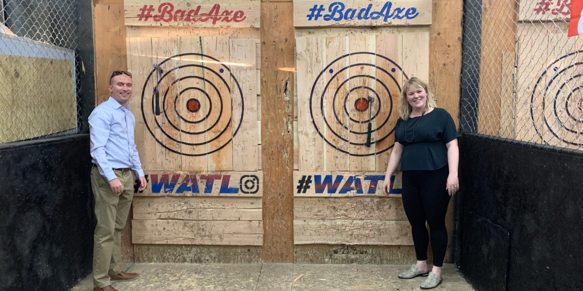 mcwhinney employees team building at an axe throwing range