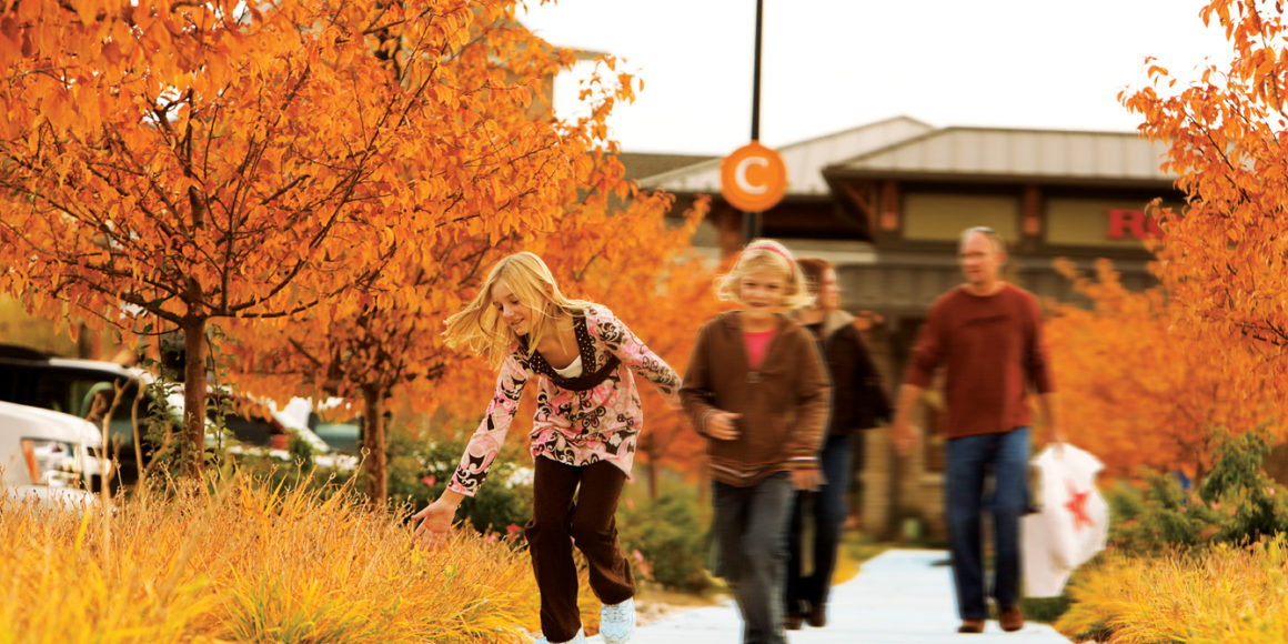 people walking at centerra master-planned community in loveland, co