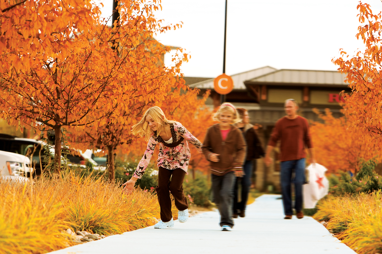 people walking at centerra master-planned community in loveland, co