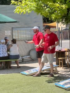 McWhinney Associates playing cornhole at a charity event